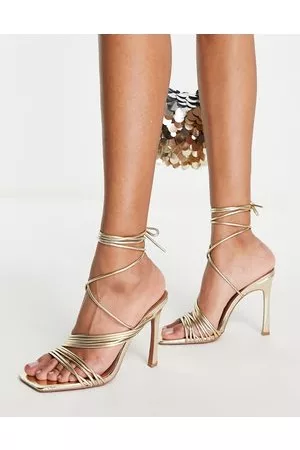ASOS Damen Sandalen mit hohem Absatz - – Nest – Riemchensandalen in Gold mit Beinschnürung und Absatz