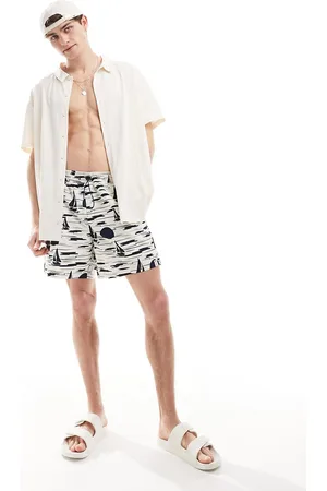 Hunky Trunks – Badeshorts in Wollweiß mit Sonnenuntergangs- und Bootmotiv
