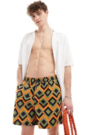 Hunky Trunks – Badeshorts mit geometrischen Streifen in und Orange