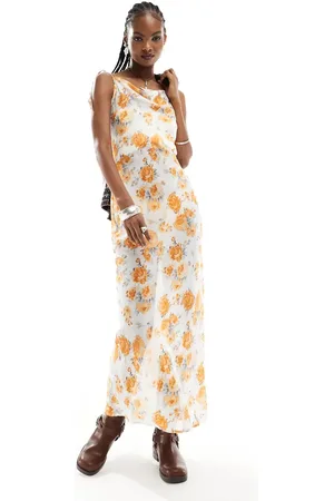 Kiss The Sky – Transparentes Maxi-Trägerkleid im 90er-Stil mit Wasserfallausschnitt und Blumenmuster