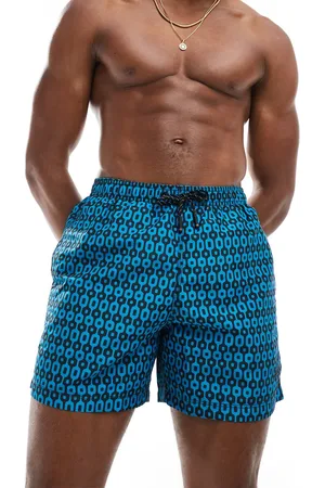 Superdry – Badeshorts mit geometrischem Muster in Marineblau, 15 Zoll Schrittlänge