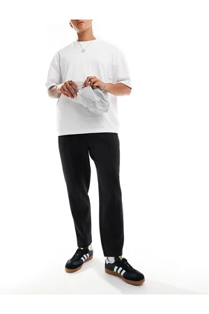 ASOS – Schmal zulaufende Jogginghose in schwarzer Neopren-Optik