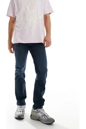 Lee Rider – Schmal geschnittene Jeans in dunkler Waschung