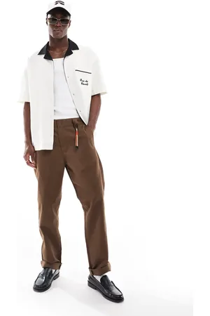 Carhartt – Master – Locker geschnittene Hose in Braun