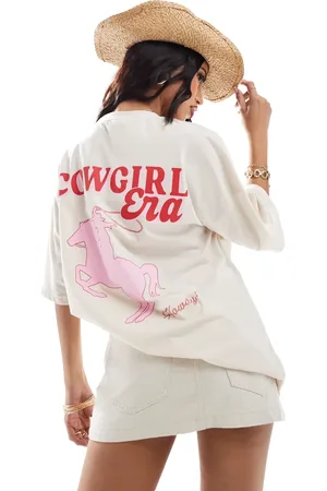 Kaiia – Oversize-T-Shirt in Creme mit „Cowgirl Era“-Logoprint hinten