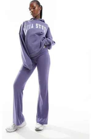 Kaiia – Ausgestellte Yogahose in mit „Studio“-Logo, Kombiteil