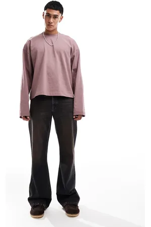ASOS – Weite Schlagjeans in blauschwarzer Waschung mit Farbstich