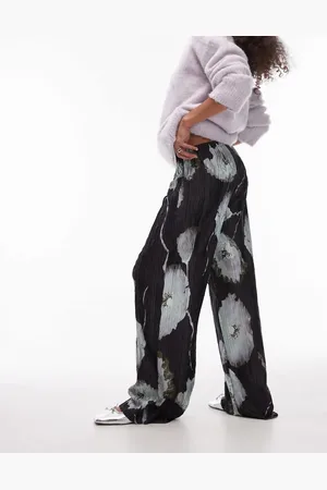 Topshop – Plissee-Hose in Schwarz mit weitem Bein und abstraktem Blumenmuster