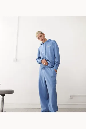 COLLUSION – Relaxed – Locker sitzende Skater-Jogginghose in mit Koordinaten-Print
