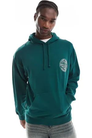 Wrangler – Casey Jones Workwear – Oversize-Kapuzenpullover in Dunkelgrün mit rundem Vintage-Logo