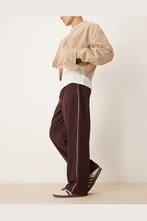 ASOS – Elegante Schlupfhose in Burgunderrot mit weitem Schnitt und seitlicher Paspelierung