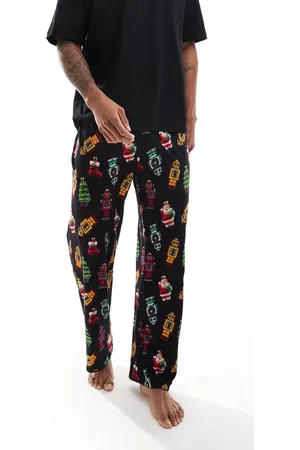 ASOS – Pyjama in Schwarz mit Weihnachtsdekomotiven