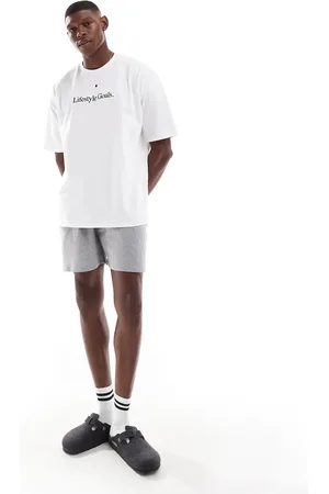 ASOS – Pyjama in Weiß mit „Lifestyle Goals“-Slogan