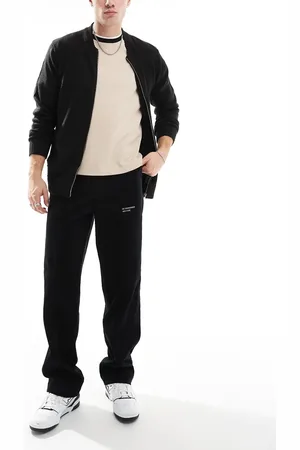 ASOS – Weite Cord-Hose in mit besticktem Aufnäher
