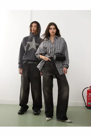 Weekday – Unisex Astro – Locker geschnittene, weite Jeans in schwarzer Acid-Waschung mit niedrigem Bund