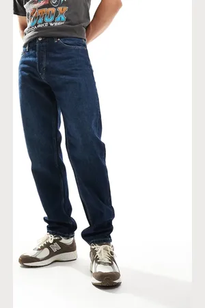 Weekday – Barrel – Schmal zulaufende Jeans in kompakter blauer Waschung mit lockerem Schnitt