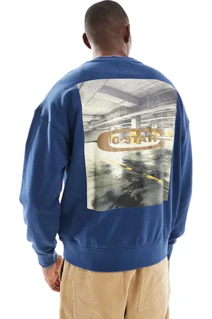 G-Star – Oversize-Sweatshirt in Dunkelblau mit Brust-Logo und Foto-Rückenprint