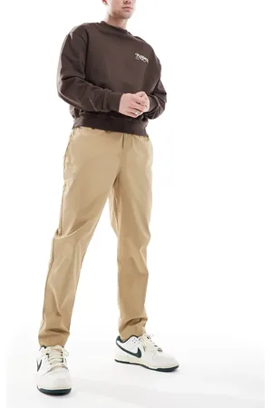 Nike – Club – Schmal zulaufende Hose aus Webstoff in Beige