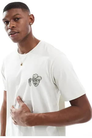 Wrangler – T-Shirt in Wollweiß mit kleinem Cowboy-Aufdruck