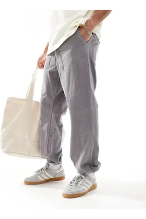 ASOS – Schmal zulaufende Cord-Jogginghose in verwaschenem