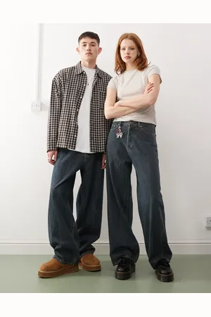 Weekday – Astro – Unisex – Weite Jeans in schlieriger mittelblauer Waschung mit niedrigem Bund und lockerem Schnitt
