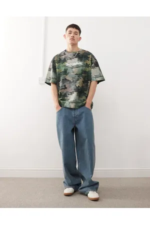 COLLUSION – X002 – Weite Jeans in mittlerer Waschung mit Skater-Taschen