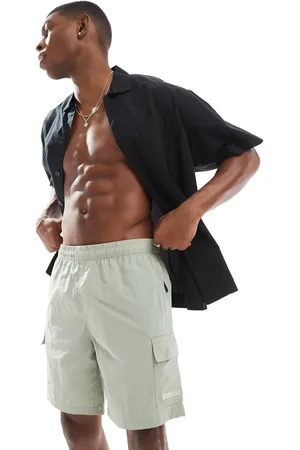 River Island – Cargo-Badeshorts in Hellgrün