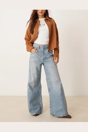 Free People – Eden – Ausgestellte Jeans in mittelblauer Waschung mit hohem Bund und lässigem Schnitt