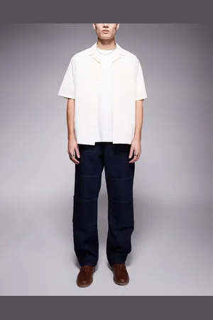 ASOS – Weite Carpenter-Jeans in hellblauer Waschung mit Tasche vorne