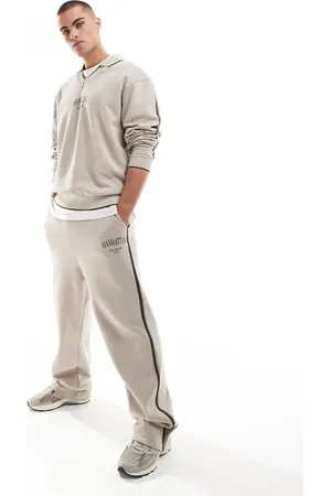 ASOS – Jogginghose in Steinbeige mit weitem Bein, seitlichem Zierstreifen und City-Print, Kombiteil