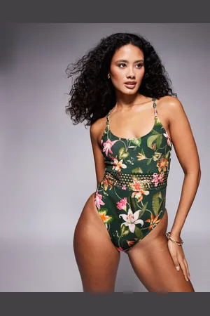 River Island – Badeanzug in Dunkelgrün mit Pflanzen-Print