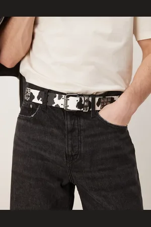 ASOS – Gürtel aus Kunstleder mit Kuhfellmuster und Nietenbesatz