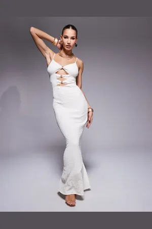 South Beach – Strukturiertes Maxi-Strandkleid in Creme mit Zierausschnitten und Metalldetails