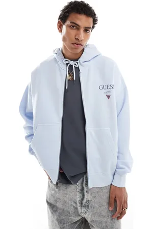 Guess – Unisex-Kapuzenjacke in Hellblau mit Stapel-Logo