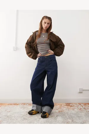 COLLUSION – X002 – Weite Jeans aus Raw-Denim mit Aufschlag