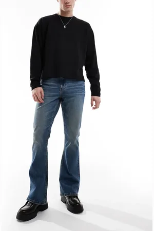 ASOS – Stretch-Schlagjeans in verwaschenem Mittelblau