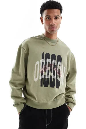 ASOS – Kastiges Oversize-Sweatshirt in grüner Acid-Waschung mit Lagenprint