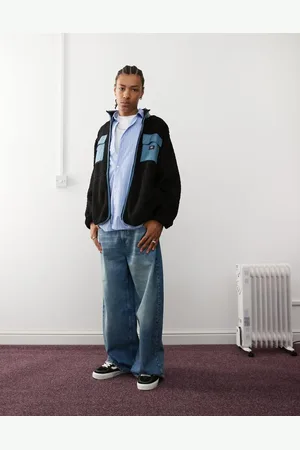 Vans – Debrusk – Oversize-Jacke in Schwarz und Blau aus Sherpa-Fleece