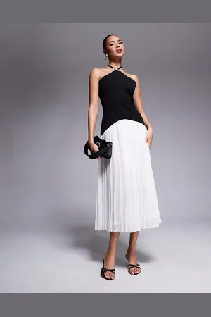 Rare Fashion London – Plissee-Midikleid in Schwarz und Weiß mit Schleifendetail, Neckholder und tiefer Taille