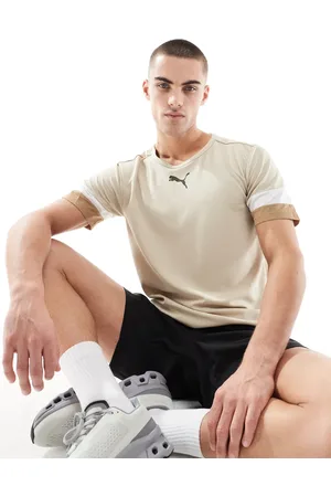 PUMA – Rise Football – T-Shirt in Beige