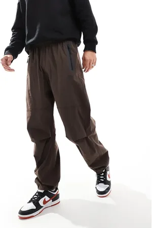 Nike – Tech – Oversize-Hose aus Webstoff in