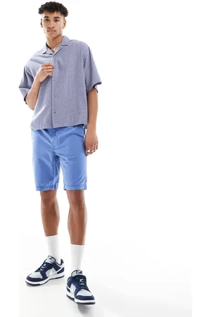 Superdry – Vintage International – Shorts in Azurblau