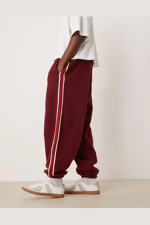 ASOS – Jogginghose in Burgunderrot mit weitem Ballon-Schnitt und Zierstreifen