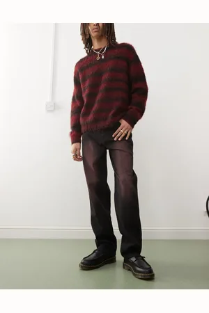 Karl Kani – Jeans in verwaschenem Schwarz mit rotem Farbspray-Detail