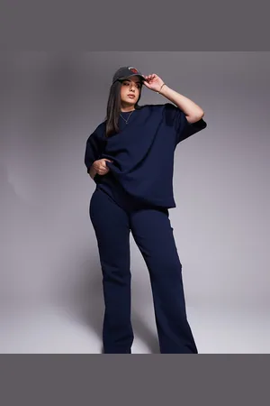 ASOS ASOS DESIGN Curve – Ausgestellte Jogginghose aus Interlock-Stoff in Marineblau, Kombiteil