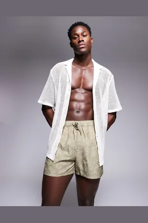 ASOS – Badeshorts in kurzer Länge in mit Blumenmuster