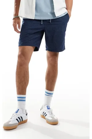 Superdry – Bermudashorts in verwaschenem Indigo mit Noppenmuster