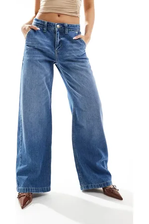 River Island – Weit geschnittene Jeans in verwaschenem Mittelblau