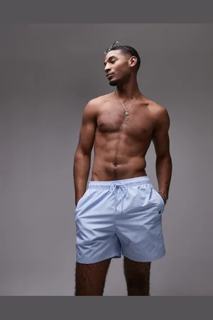 Tommy Hilfiger – Pastellblaue Badeshorts mit seitlichem Logo und Kordelzug