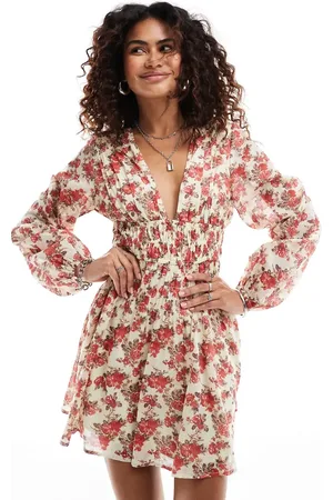 Free People – Kurzes Boho-Kleid in leuchtendem mit Blumenmuster und V-Ausschnitt